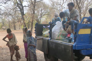 Panchayat representatives in Bijapur distributing drought rations to the poor