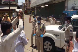 people honor police men showering flower