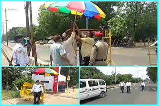 Police personnel get umbrella for heat relief in lockdown