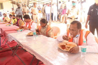 minister malla reddy lunch with workers in medchal distric