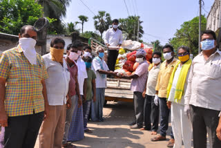 tdp leaders distributing essential things to poor people in west godavari