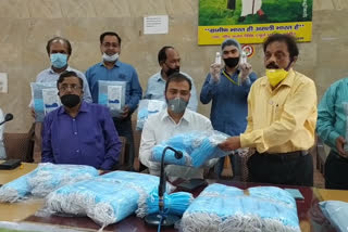 Social workers handed over PPE kit to the district administration