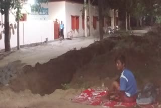 The young man stay in outside due to no space in quarantine center