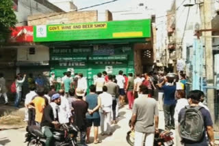 People throng liquor shops, violate social distancing norms in Delhi