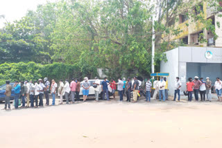 long queue at liquor shop in vizag city