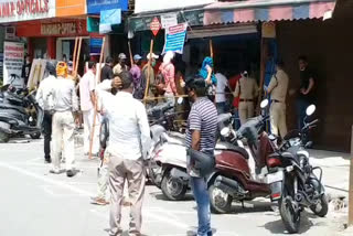 People standing on the streets for alcohol