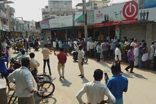 people throw stones on alcohol store