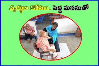 a-woman-did-cutting-for-oldage-people-at-sahrudaya-orphans-home-in-warangal