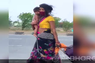 Journey from Gujarat to UP with daughter in her lap