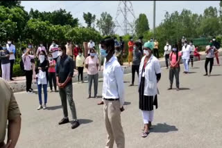 Staff nurses and health workers protest outside State Institute of Medical Sciences in Greater Noida corona virus