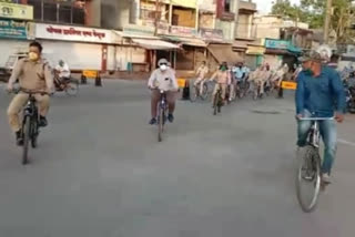 Police patrolling bicycle in narrow streets