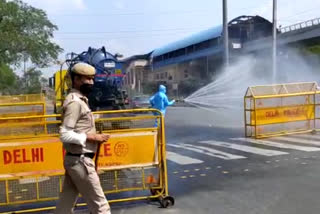 police barricades get sanitized at moti nagar in delhi