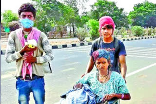 migrant brother and sister going their home by road with wheel chair