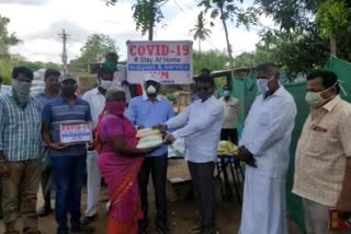 Distributing essential goods to the poor people in challpalli  krishna district