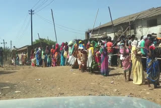 Queue of women outside