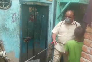 Former MLA from Seemapuri Assembly sprayed sanitizer in slums