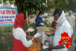 Gurudwara Sri Guru Singh Sabha distributing food to needy in Rohini