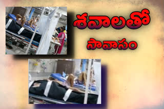 a video shows bodies wrapped in plastic lying next to patients at Mumbai’s KEM Hospital