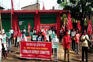 aituc silent protest because of labour time increased 8 to 12 hours