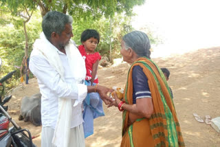 Distributing lunch packets to poor people in Suriyapet district Singaram