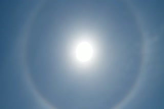 The miraculous ring around the sun, the auspicious sign for the world, shines brightly.