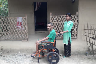 Smile Dibrugarh NGO donate a Huil chair to Janmoni's father