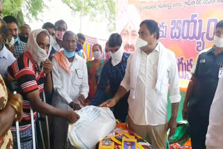 Minister distributes the goods to the poor people at warangal rural