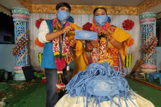 COVID-19: Wedding cards printed on masks in Andhra Pradesh