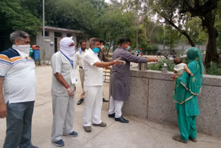 Milk distributed to women and children in East Sagarpur Shelter Home in Dwarka , Delhi