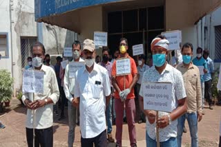 Workers strike for demand dues in front of a Neelachal steel plant