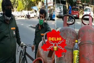 During lockdown delivery boys delivering gas cylinders to homes