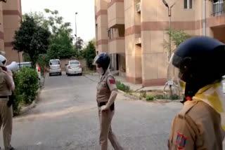 Women policemen make public awareness by announcing in police colony in Dwarka, Delhi