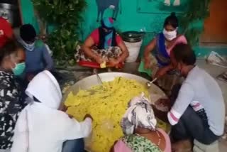 members of brigade preparing food