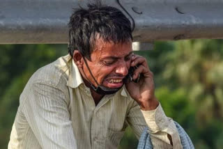 Migrant worker breaks down while Talking to family member on phone