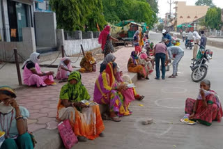 Helping the Poor Group is helping the beneficiaries standing outside the bank in burhanpur