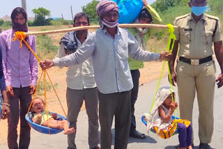 a-migrate-worker-started-to-go-his-own-state-on-foot-and-arrange-dolli-to-carry-his-two-small-kids-at-kurnool-dst