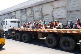 migrants travelling to kolkata in national highway by lorries captured by et bharat at bhogapuram