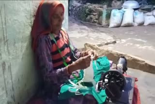 Poor woman distributing free masks in poanta