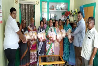 Muslim municipality members distribute kitchen items to poor women