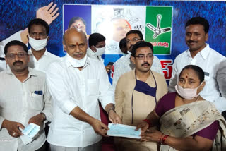 cheques distributes to  persons in  east godavari dst  by mla sathi suryanarayana