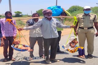 plight of Migrant Workers  Bihari  Lockdown  Andhra Pradesh police  Doli  COVID 19  Migrant Exodus  Migrant sets off on long march with kids  cops come to rescue migrant on long march with kids  இடம்பெயர்ந்த தொழிலாளர் பிரச்னை  இடம்பெயர்ந்த தொழிலாளர்  கைக்குழந்தையுடன் 1000 கி. மீ பயணம்