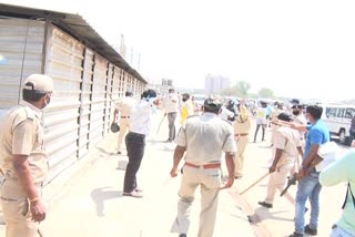 ahmedabad stone pelting on police by migrant workers near iim inahmedabad