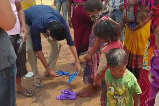 Slippers being worn on the feet of laborers