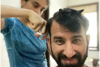 cheteshwar pujara gets  haircut from wife