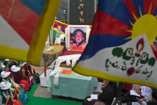 A portrait of the 11th Panchen Lama, Gendhun Choekyi Nyima, an important religious leader second only to the Dalai Lama in the Tibetan Buddhist hierarchy, is seen as exile Tibetans mark his birthday in Dharmsala, India.