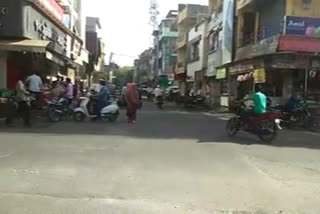 Crowds of people opening shops in Godhra,