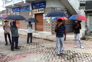 Gujarat village enforces social distancing using umbrellas