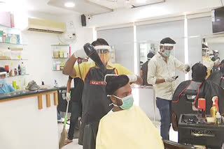 Haircut wearing mask and face shields in warangal