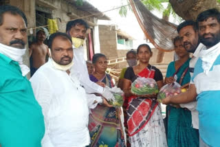 tdp leaders distributed essentials to poor in Guntur