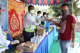 tata project agm working in amalapuram highway helps immigrants by distributing essentials